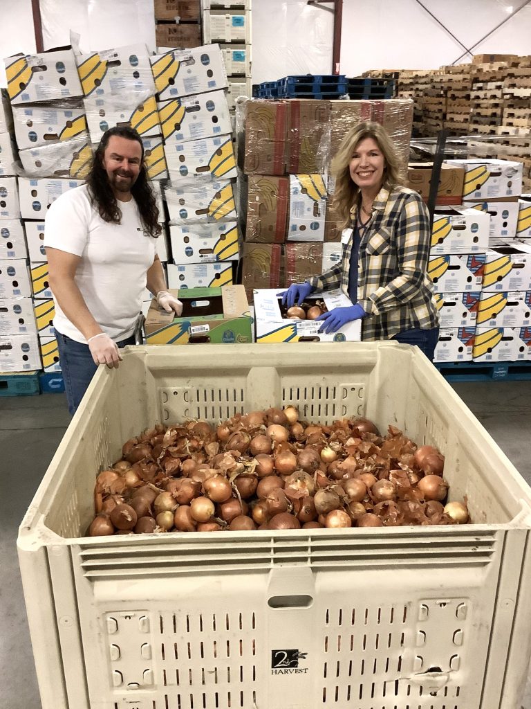 Volunteers sort onions in Pasco
